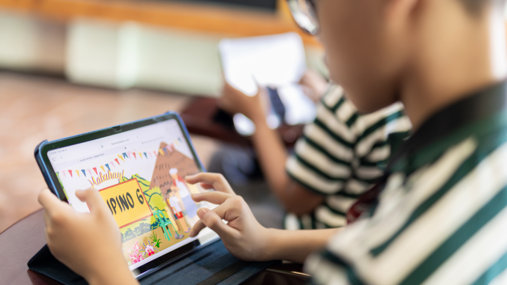 Students learning with Apple devices in a classroom